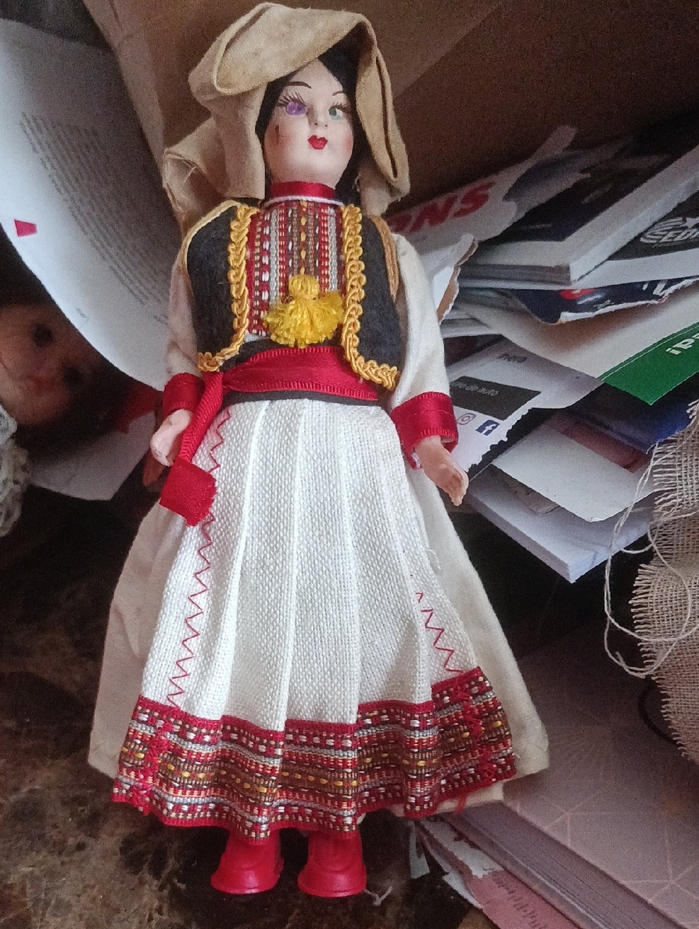 vintage collectible doll is a folk art souvenir representing traditional costume